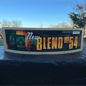 PLASTIC CURVED MARLBORO BLEND SIGN MOUNTED ON FRAME 33" X 10"